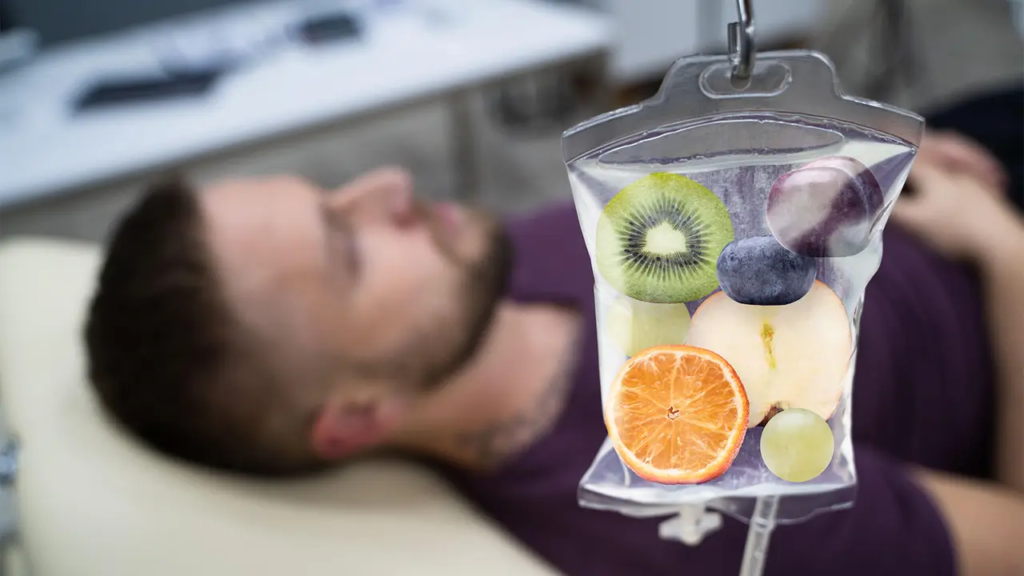 IV bag with fresh fruit inside hanging above a person reclining