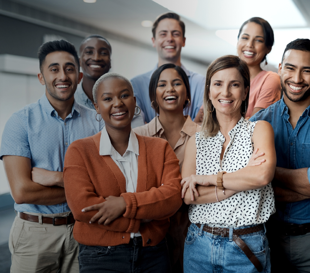 Group of diverse professionals standing together smiling