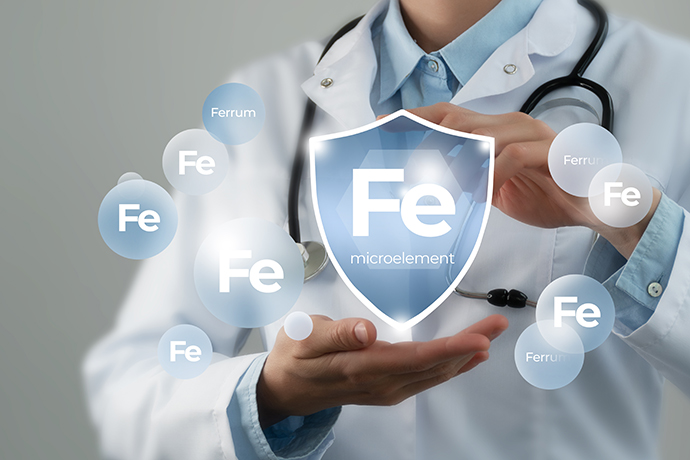 Doctor holding a shield icon with the chemical symbol for iron (Fe)